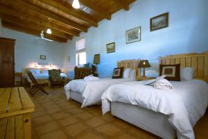 a bedroom with two beds in a room at The Barracks in Colesberg