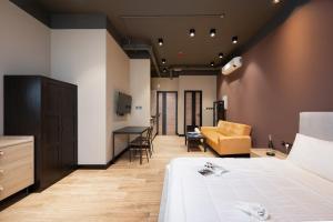 a hotel room with a bed and a living room at Elegant space Studio by Spacey Duqm 82 in Duqm