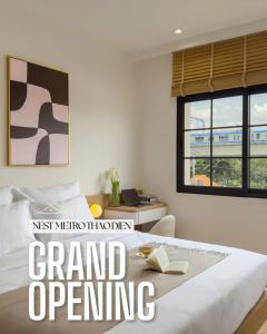 a bedroom with a bed with a book on it at CityHouse - Nest Metro Thảo Điền in Ho Chi Minh City
