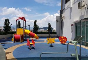 a playground with a slide in a building at IPOH The Majestic Ipoh Town View Fully Air-Con Homestay in Ipoh +14 photos