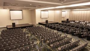 a conference room with chairs and screens in it at Hotel Jequitimar Guaruja Resort & Spa by Accor - Ex Sofitel in Guarujá +71 photos