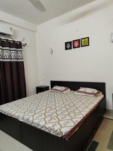 a bedroom with a bed in a room at ALPANEST - Near GMCH and B Barooah Cancer in Guwahati +24 photos