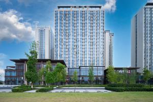 a rendering of a large building with tall buildings at 舒邑酒店 天府国际机场店 in Jianyang