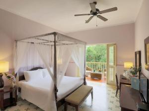 Ένα ή περισσότερα κρεβάτια σε δωμάτιο στο La Veranda Resort Phu Quoc - MGallery