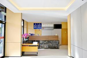 a lobby of a building with a reception desk at Huayi Select Hotel Liujiayao Subway Station Hengliutiao Branch in Beijing +15 photos