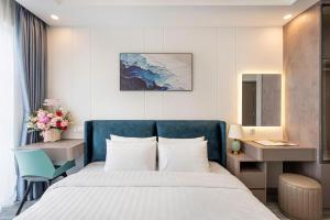 Postel nebo postele na pokoji v ubytování Zenda Villa Novaworld Phan Thiết + 27 fotografií