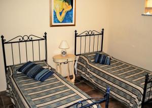 A bed or beds in a room at Rosso Di Sera