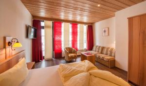 Postel nebo postele na pokoji v ubytování Rustika - Appartements & Spa