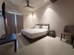 Ένα ή περισσότερα κρεβάτια σε δωμάτιο στο Hotel Pearls