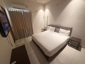 Ένα ή περισσότερα κρεβάτια σε δωμάτιο στο Hotel Pearls