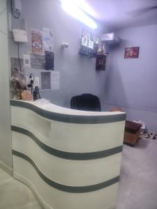 a waiting room with a desk with a chair at Imperial residency in New Delhi +26 photos