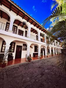 an exterior view of a building with a courtyard at Colonial House 8 rooms and private parking in Antigua Guatemala in Antigua Guatemala