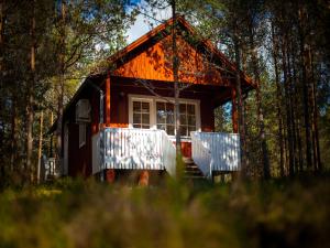 a small house in the middle of a forest at Roosta Holiday Village in Noarootsi