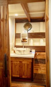 a bathroom with a sink and a mirror at Kamma Sail in Labuan Bajo +127 photos