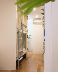 a hallway with bunk beds in a room at Mik Stay in Danang