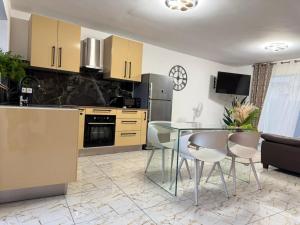 a kitchen with a table and chairs in a room at Madikera Resort in Saint-François