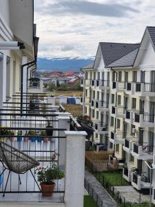 a view from the balcony of a apartment building at La Ana Apartament in Şelimbăr