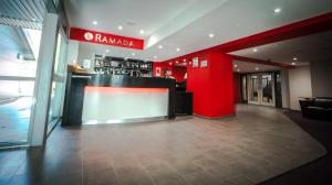 a large room with a large counter and a large window at Ramada London South Mimms in Potters Bar