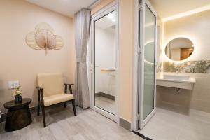 a bathroom with a shower and a sink at HemTouch House - Nguyễn Văn Mai in Ho Chi Minh City +171 photos