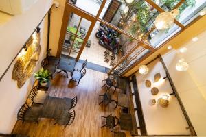 an overhead view of the lobby of a house at HemTouch House - Nguyễn Văn Mai in Ho Chi Minh City