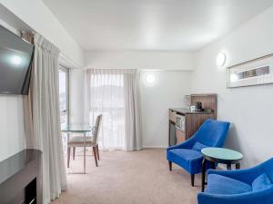 Телевизор и/или развлекательный центр в Mercure Wellington Central City Hotel and Apartments