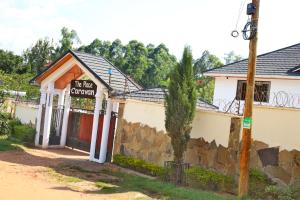 a building with a sign that reads hit the church at Stays with Nala in Kakamega