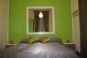 Il Postiglione Hotel - Sala Ricevimenti Minturno tesisinde bir odada yatak veya yataklar