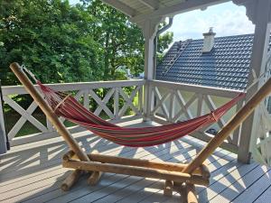 Balkón nebo terasa v ubytování Domek pod Kapeluszem nad jeziorem Patulskim,sauna , opcja balii,kuligi,stok Koszałkowo