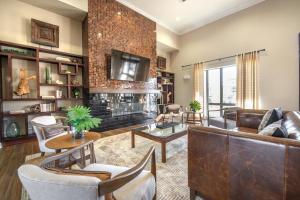 a living room with a couch and a table at Landing Apartments - Spring, TX in The Woodlands