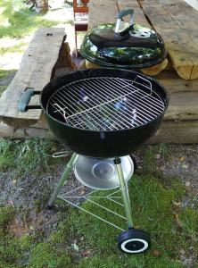a grill sitting on the grass next to a table at Haramura - house / Vacation STAY 2211 in Hara