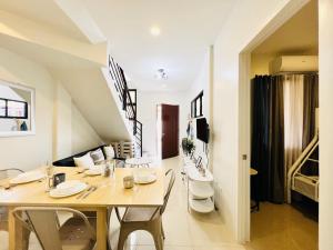 a dining room with a table and chairs at 4BR House in Pardo Cebu Perfect for Groups in Cebu City