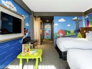 Кровать или кровати в номере Pullman Sao Paulo Guarulhos Airport +38 фотографий