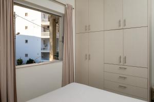 Ένα ή περισσότερα κρεβάτια σε δωμάτιο στο Vasiliki Coastal Apartment