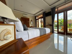 TV a/nebo společenská místnost v ubytování Jambangan bali ubud
