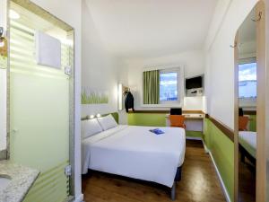 Кровать или кровати в номере ibis budget Porto Alegre - Super Econômico