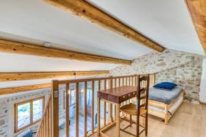 Ένα ή περισσότερα κρεβάτια σε δωμάτιο στο Gîte De La Riviere