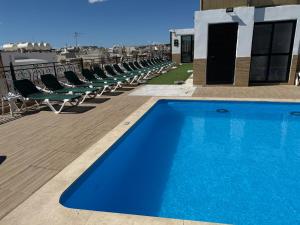 a swimming pool on the roof of a building at The Windsor Hotel in Sliema