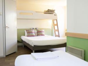 a room with two bunk beds and a ladder at ibis budget Narbonne Sud A9/A61 in Narbonne +55 photos