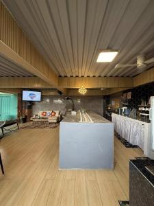 a large room with a counter in the middle of a restaurant at Casa Andrea Bella in Bacolod +19 photos