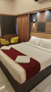 Ένα ή περισσότερα κρεβάτια σε δωμάτιο στο Joy Vista Resort