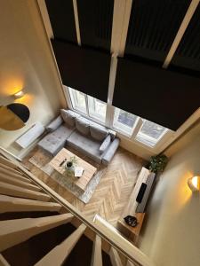 an overhead view of a living room with a couch at Central City Apartment in Central Station
