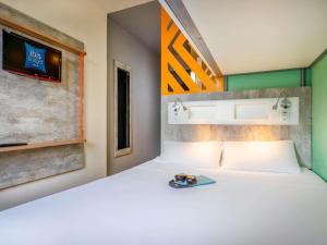 Кровать или кровати в номере ibis budget SP Centro Sao Joao