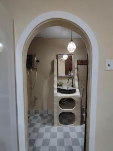 a bathroom with a sink and a mirror at Nắng Vĩnh Hy in Ninh Hải