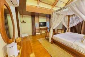 Postel nebo postele na pokoji v ubytování Mandala Beach Resorts powered by Cocotel