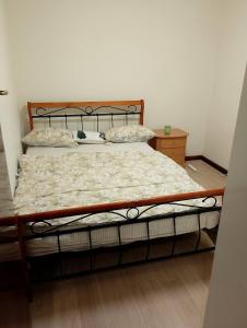 a bed in a room with a bed frame at 4 Bed, 1 Wash and Extra Toilet - Close to Parramatta CBD - Full House in Sydney