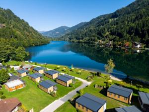 an aerial view of a village next to a lake at Fischerhof Glinzner Hotel-Restaurant-Camping in Afritz