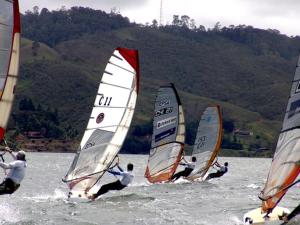a group of people windsurfing in the water at Villa Daniela Restrepo in Restrepo
