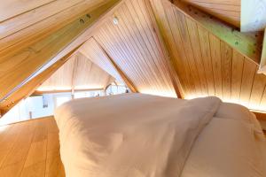 a bed in a room with an attic at The Nest Teshikaga in Teshikaga +31 photos