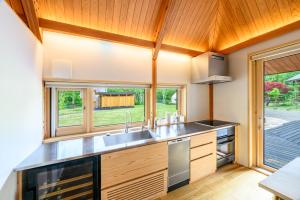 a kitchen with a sink and a window at The Nest Teshikaga in Teshikaga
