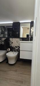 Koupelna v ubytování Albergo Flaminia Rooms + 13 fotografií